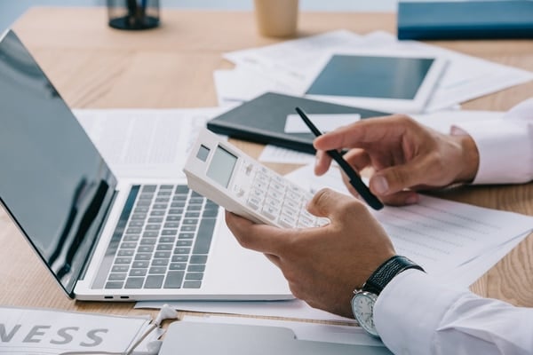 A businessman making calculations