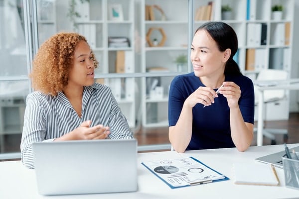 Two financial managers discussing new banking system